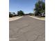 Wide shot of a quiet residential street lined with well-maintained homes at 1022 E Keim Dr, Phoenix, AZ 85014