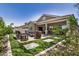 Inviting backyard with a manicured lawn, paver accents and a covered patio at 1026 N 152Nd Ave, Goodyear, AZ 85338