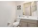 Well-maintained bathroom featuring modern fixtures, a decorative mirror, and a clean toilet area at 1026 N 152Nd Ave, Goodyear, AZ 85338