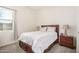 Bedroom featuring neutral carpet and window at 1026 N 152Nd Ave, Goodyear, AZ 85338