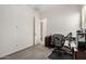 Clean and bright bedroom space with office setup and view to attached bathroom at 1026 N 152Nd Ave, Goodyear, AZ 85338