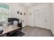 Functional bedroom with a modern desk setup and a spacious closet at 1026 N 152Nd Ave, Goodyear, AZ 85338