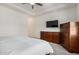 Bedroom with recessed ceiling features neutral carpet and furniture at 1026 N 152Nd Ave, Goodyear, AZ 85338
