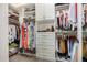 Walk-in closet featuring custom shelving and organization system to maximize storage at 1026 N 152Nd Ave, Goodyear, AZ 85338