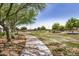 Community park with lush green grass and sidewalk. Ideal for leisurely strolls at 1026 N 152Nd Ave, Goodyear, AZ 85338