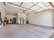 Spacious garage featuring epoxy flooring, storage cabinets, and fitness equipment at 1026 N 152Nd Ave, Goodyear, AZ 85338