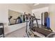 Garage featuring mirrors and gym equipment for convenient at-home fitness at 1026 N 152Nd Ave, Goodyear, AZ 85338