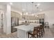 Gourmet kitchen featuring a large island, stainless steel appliances, and pendant lighting at 1026 N 152Nd Ave, Goodyear, AZ 85338