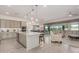 Open-concept living space connecting the kitchen, dining, and living areas for seamless interaction at 1026 N 152Nd Ave, Goodyear, AZ 85338