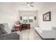 Comfortable office with tile flooring features lots of natural light, sofa, and neutral paint at 1026 N 152Nd Ave, Goodyear, AZ 85338