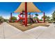 Community playground featuring a large shade structure and fun play equipment at 1026 N 152Nd Ave, Goodyear, AZ 85338