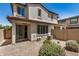 Private backyard featuring desert landscaping, covered patio, and direct access to the house at 1153 W Diamondback Dr, Chandler, AZ 85286