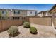 Cozy backyard space with gravel landscaping, privacy walls, and low-maintenance greenery at 1153 W Diamondback Dr, Chandler, AZ 85286