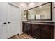 This is a bathroom with dual sink vanity, a mirror, and door at 1153 W Diamondback Dr, Chandler, AZ 85286