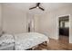 This is a bedroom with ceiling fan and attached bath in view at 1153 W Diamondback Dr, Chandler, AZ 85286