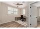 The office has wood-look floors and a desk with rolling chair at 1153 W Diamondback Dr, Chandler, AZ 85286
