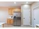 Bright kitchen features wooden cabinetry, white countertops and stainless steel appliances at 12910 W Junipero Dr, Sun City West, AZ 85375