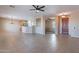 Open floor plan living area featuring tile flooring and natural light at 12910 W Junipero Dr, Sun City West, AZ 85375