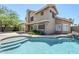 Beautiful backyard with a shimmering pool and a well-maintained lawn, ideal for outdoor activities at 1311 N Congress Dr, Chandler, AZ 85226