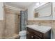 Cozy bathroom featuring a tiled shower with a rainfall showerhead at 1311 N Congress Dr, Chandler, AZ 85226