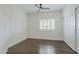 Neutral bedroom with hardwood floors, plantation shutters, and a closet at 1311 N Congress Dr, Chandler, AZ 85226
