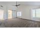 Spacious bedroom with vaulted ceiling and access to bathroom at 1311 N Congress Dr, Chandler, AZ 85226