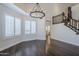 An open dining room offers hardwood floors, natural light and staircase access at 1311 N Congress Dr, Chandler, AZ 85226