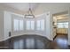 Dining area featuring gorgeous hardwood floors, and plantation shutters at 1311 N Congress Dr, Chandler, AZ 85226