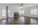 Bright and airy living room with hardwood floors, fireplace, and patio access at 1311 N Congress Dr, Chandler, AZ 85226