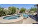 Beautiful pool and spa surrounded by lush landscaping, offering a relaxing outdoor oasis at 1311 N Congress Dr, Chandler, AZ 85226