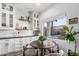 Eat in kitchen with dark countertops and a table near a window, cabinets and subway tile backsplash at 1312 W Bartlett Way, Chandler, AZ 85248