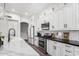 Bright kitchen with white cabinets, quartz countertops, stainless steel appliances and subway tile backsplash at 1312 W Bartlett Way, Chandler, AZ 85248