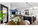 Open floor plan with a large kitchen with an island and a bright living room with a television and comfortable seating at 1312 W Bartlett Way, Chandler, AZ 85248