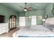 Comfortable main bedroom featuring wood laminate flooring, a ceiling fan, and tasteful decor at 1312 W Bartlett Way, Chandler, AZ 85248