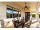 Covered patio area with outdoor dining table and chairs, perfect for entertaining at 1312 W Bartlett Way, Chandler, AZ 85248
