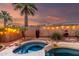 Backyard pool featuring a hot tub, desert landscaping, and decorative lighting at 1312 W Bartlett Way, Chandler, AZ 85248