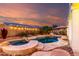 Beautiful backyard pool with hot tub, lush landscaping and ambient string lights for relaxing evenings at 1312 W Bartlett Way, Chandler, AZ 85248