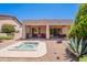 Backyard featuring a hot tub, covered patio, desert landscaping, and outdoor seating at 14806 E Lookout Ledge --, Fountain Hills, AZ 85268