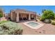 Backyard with a hot tub, covered patio, desert landscaping, and outdoor seating at 14806 E Lookout Ledge --, Fountain Hills, AZ 85268