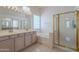 Bright bathroom featuring dual sinks, a soaking tub, and a separate glass-enclosed shower at 14806 E Lookout Ledge --, Fountain Hills, AZ 85268