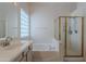 View of the bright and clean bathroom featuring a separate glass-enclosed shower and a soaking tub at 14806 E Lookout Ledge --, Fountain Hills, AZ 85268