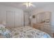 Bright bedroom with neutral tones, ceiling fan, and large dresser with mirrors at 14806 E Lookout Ledge --, Fountain Hills, AZ 85268