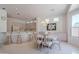 Open concept dining area featuring a neutral color palette, tile flooring, and view into the kitchen at 14806 E Lookout Ledge --, Fountain Hills, AZ 85268