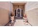 Covered home entrance with light beige walls, decorative planters and a secured front door at 14806 E Lookout Ledge --, Fountain Hills, AZ 85268