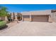 Tan home showcasing a large driveway and attached garages with desert landscaping and blue skies overhead at 14806 E Lookout Ledge --, Fountain Hills, AZ 85268