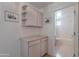 Hallway featuring a storage cabinet and a glimpse into a bright bathroom at 14806 E Lookout Ledge --, Fountain Hills, AZ 85268