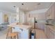 Open-concept kitchen with breakfast bar, white appliances, tile floor, and access to the living area at 14806 E Lookout Ledge --, Fountain Hills, AZ 85268