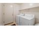 Functional laundry room with a full-size washer and dryer, plus overhead shelving at 14806 E Lookout Ledge --, Fountain Hills, AZ 85268