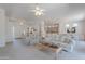 Spacious living room featuring neutral carpet, light colored couches, and ample natural light from nearby windows at 14806 E Lookout Ledge --, Fountain Hills, AZ 85268
