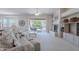 Spacious living room features tile fireplace, backyard access, and neutral colored furniture at 14806 E Lookout Ledge --, Fountain Hills, AZ 85268